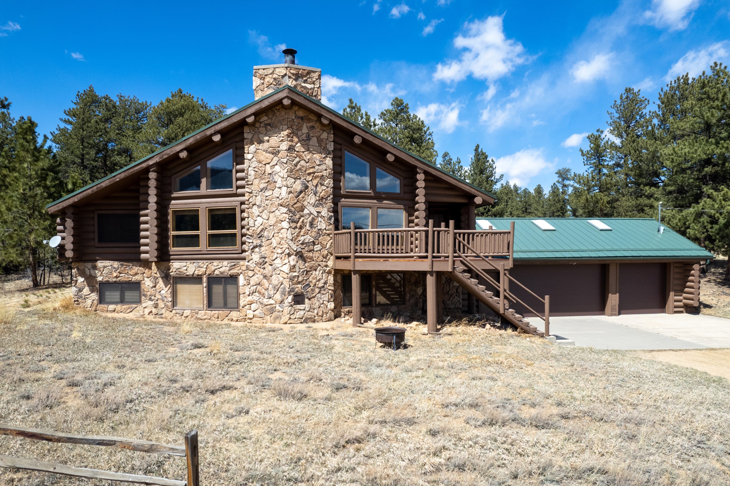Our 3,500 SF Luxury Log Cabin Ranch Lodge offers magnificent modern amenities with a rustic feel. Features a 3-car garage, fire pit, game room with pool table, and bar area. Sleeps 8-12 guests. 
